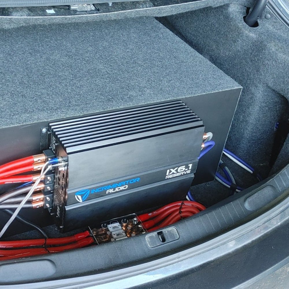A car stereo system installed into the trunk of a vehicle by XD Audio.